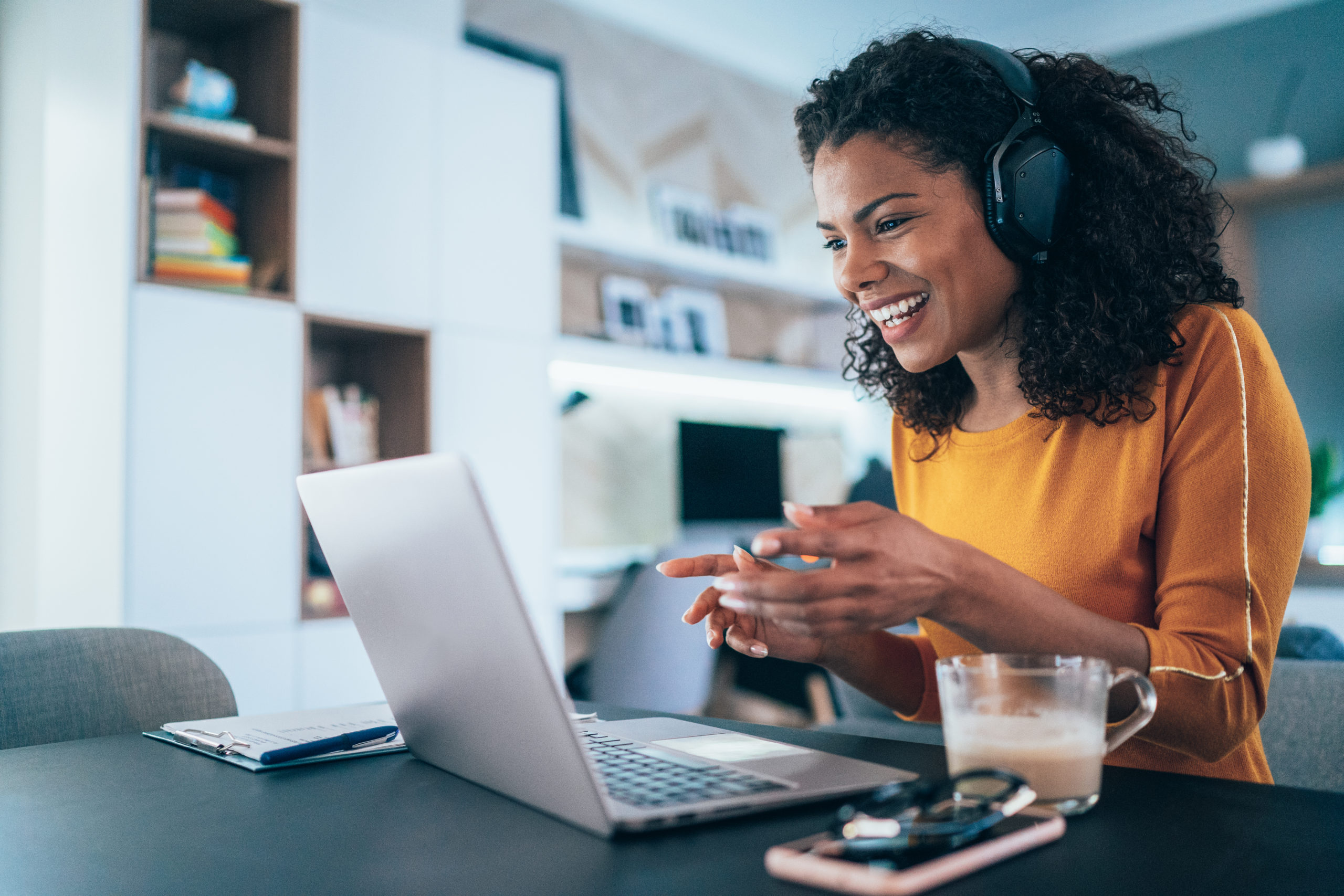 Young modern woman having Video Conference at home